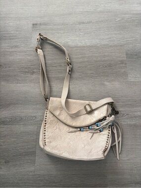 The Sak Cream Embossed Crossbody Bag with Bead Tassel